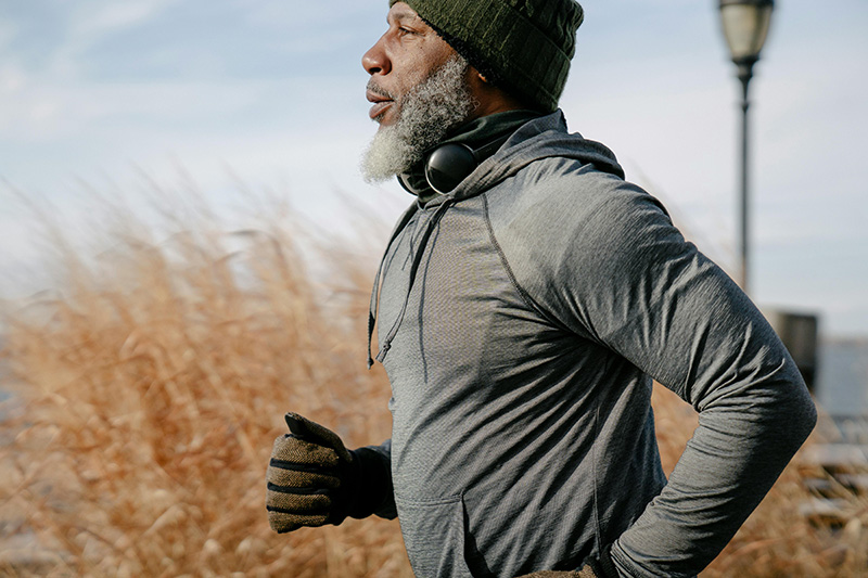 black senior man muscular running outdoors